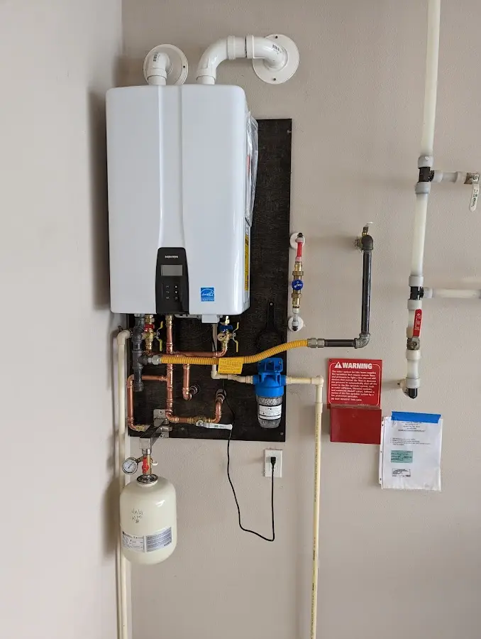 Professional plumber installing copper piping in a Kettering home